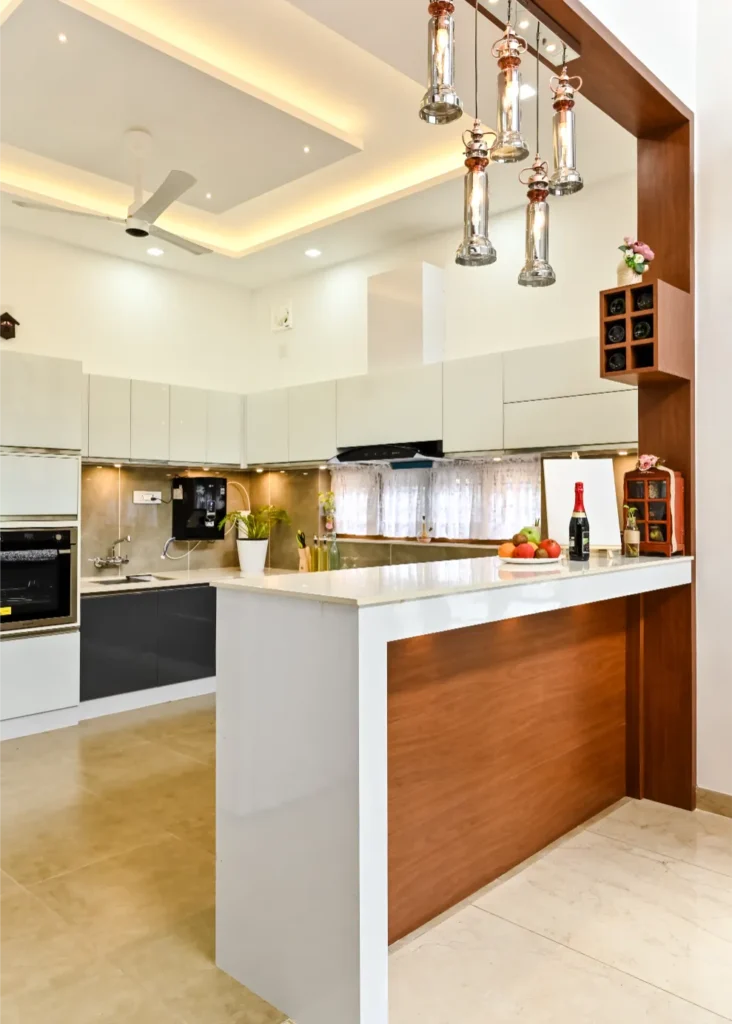 Kitchen island with modern lighting – Avanti Residence Thrissur