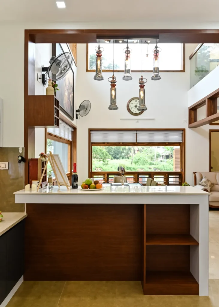 Kitchen breakfast bar facing living area – Avanti Residence Thrissur