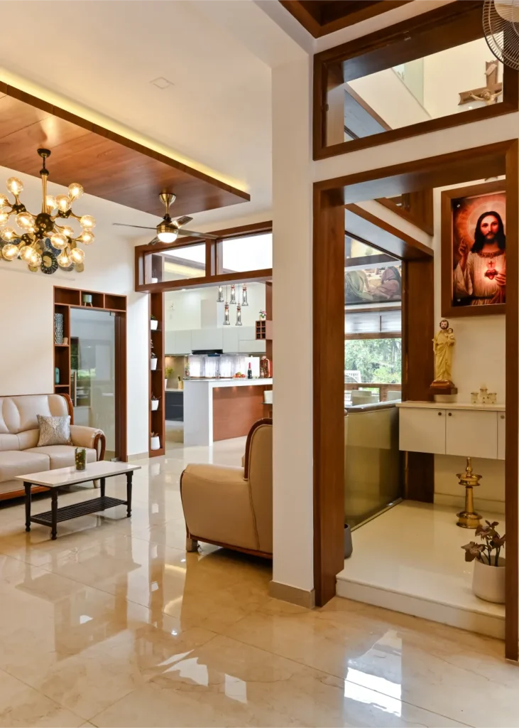 Living area view with prayer space and kitchen connection – Avanti Residence Thrissur