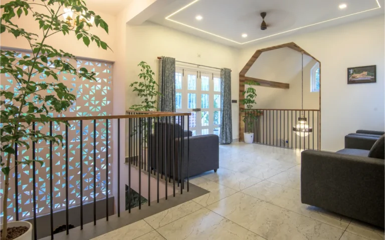 Upper living area with railing and jali wall – Castle Residence Thiroor