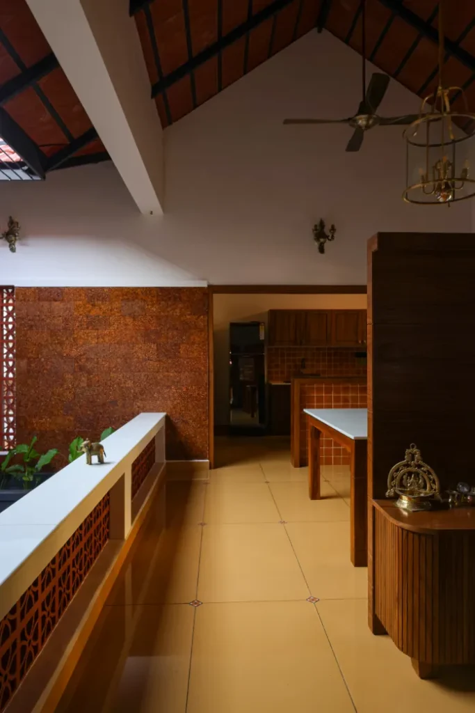 Corridor view showing kitchen and courtyard – Courtyard House Wadakkanchery