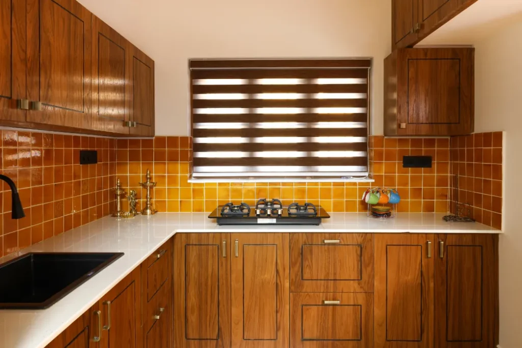 Wooden kitchen with yellow backsplash – Courtyard House Wadakkanchery