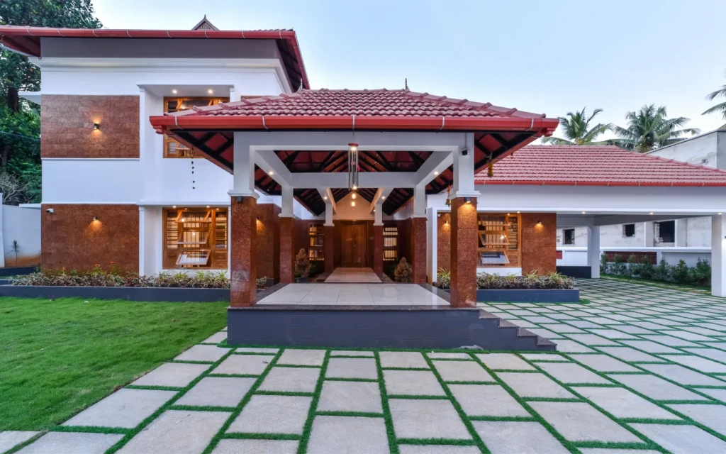 Front elevation with portico and green courtyard – Trikkur Residence Thrissur