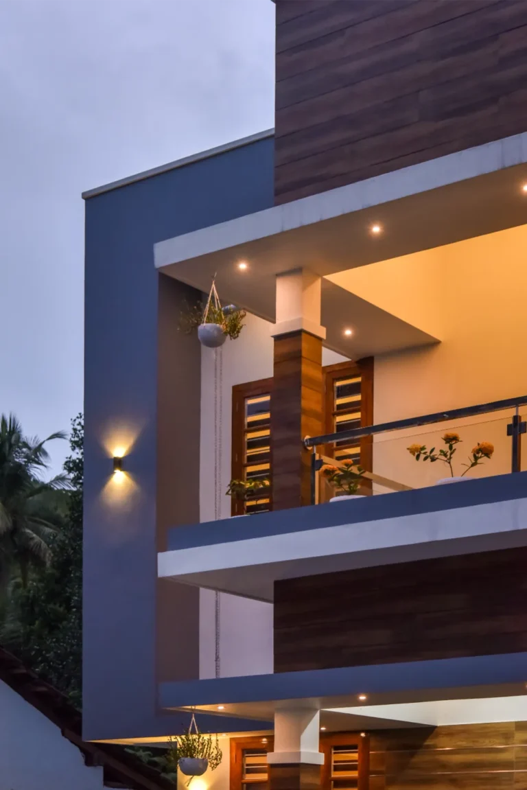 Upper balcony close-up with hanging plants and lighting – Varghese Residence Wadakkanchery