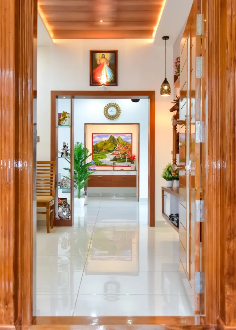 Wooden hallway with artwork and lighting – Varghese Residence Wadakkanchery