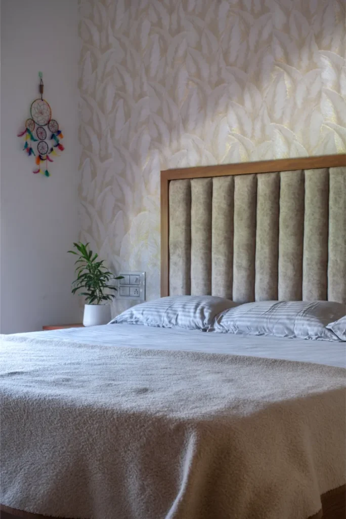 Bedroom with printed wallpaper and soft beige palette – Vasudevam Residence Chalakudy