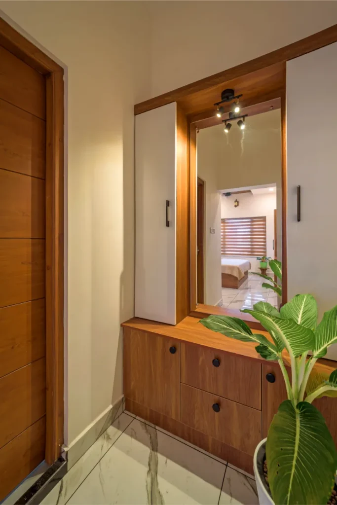 Dressing area with mirror and overhead spotlight – Vasudevam Residence Chalakudy