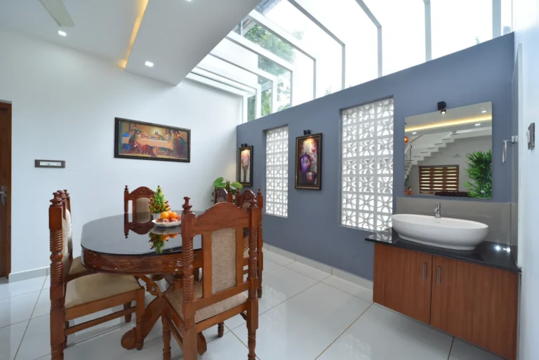 Dining space with skylight and jali wall – Varghese Residence Wadakkanchery